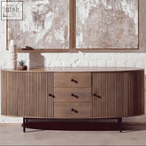 A sleek grey mango wood torello two door three drawer sideboard with oval shape and vertical ribbed panels and dark knobs