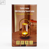 Gold-toned crystal lantern touch lamp with usb charging and cylindrical glass body in arched metal frame