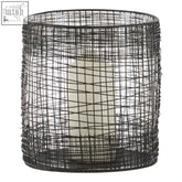 Black wire mesh cylindrical lantern with a white pillar candle inside trento cylindrical lantern design