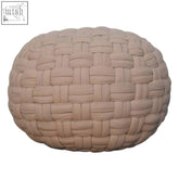 Beige woven fabric tube pouffe with a textured interlaced pattern perfect as a cream footstool