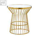 Gold wireframe side table with clear glass top featuring tula gold finish corset base design for stylish decor