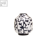 A sleek black earthenware vase with bold white abstract pattern perfect for modern home decor