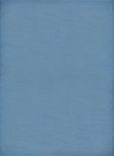 Solid light blue textured fabric surface of an urban outdoor rug perfect for outdoor rug blue settings