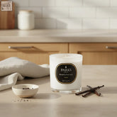 White glass vanilla candle 220g with parks london aromatherapy label highlighting therapeutic benefits