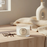 A white vanilla candle 70g in a clear glass jar with minimalist label by parks using coreless clean-burn technology