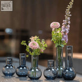 Dark blue mouth blown glass vases from the dutz collection with rounded bottoms and the dutz logo etched on the side