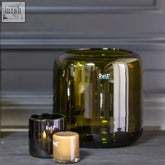 Olive-green mouth blown glass candle holder from dutz collection with sleek modern design and dutz brand logo