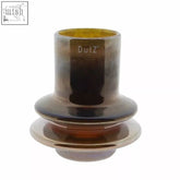 A sleek tiered glass vase from dutz collection with mouth blown amber to dark brown gradient and glossy gold luster finish