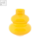 A translucent orange mouth blown glass vase from the dutz collection with stacked rounded design and etched dutz logo