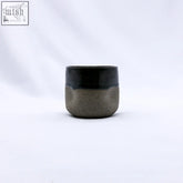 Minimalist verde goccio handmade ceramic smoked grey stoneware short cup with glossy black rim and textured body