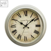Vintage-style round wall clock with silver metal frame cream antique white clock face and black roman numerals by edinburgh clock co