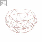 A delicate rose gold wire pink fruit basket with geometric design and ball feet for stylish fruit display