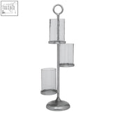 Silver-toned verve floor standing 3-light candle holder with three clear glass cylinders on a tiered metal stand