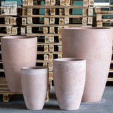 Pink terracotta vessara vase planter with textured rustic finish made of pigmented concrete, 100cm tall XXL pot