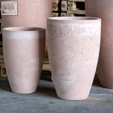 Rustic pink terracotta extra large tall concrete planter with chipped textured surface in blushstone style