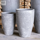 Gray vessara planter vase planter made of pigmented concrete with speckled textured surface for indoor outdoor use