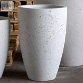 White mist tapered cylindrical planter made of premium pigmented concrete in textured white finish for large plants