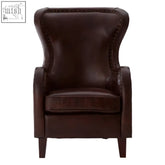 Dark brown leather victor lounge chair with high back button-tufted details and walnut wood legs