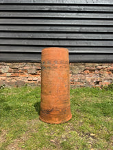 Victorian terracotta chimney pot garden planter with weathered orange brown finish and decorative engraved band