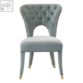 Villi blue velvet tufted dining chair with light blue velvet tufted upholstery and gold-tone legs