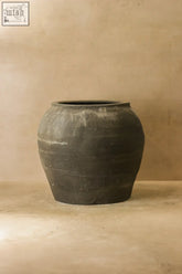 Dark gray rustic ceramic vintage dark pot with rounded body and flared rim vintage dark pot no 67