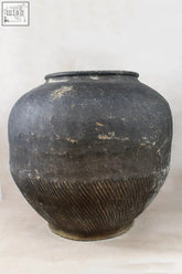 Vintage dark pot xl n 12 is a weathered dark gray storage jar with ribbed unglazed exterior showing folk artistry