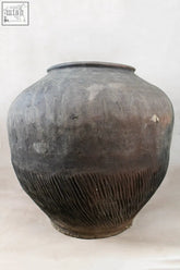Vintage dark pot xl nº 7 with a weathered dark gray ceramic body and ribbed unglazed exterior from village potter