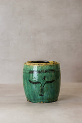 Vintage emerald green ceramic pot with black plant motif and yellow rim perfect for home decor or plants