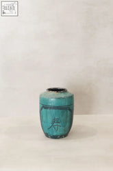 Vintage emerald green ceramic pot with black chinese character painted on its side in emerald green pot style