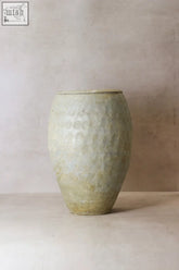 A vintage glazed yunnan pot yp01 is a matte pale green ceramic antique preservation vessel with subtle texture from late 19th china