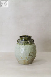 Vintage glazed yunnan pot yps07 is a late 19th century ceramic preservation vessel with a green rim and pale chipped body