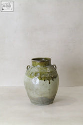 Vintage glazed yunnan pot ceramic jar with green gray glaze and circular neck patterns from late 19th century