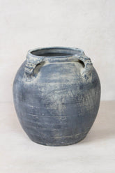 A vintage lion ears dark gray ceramic pot with weathered texture and two carved dragon-head handles