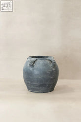 A vintage lion ears dark matte gray ceramic jar with four sculpted animal head handles perfect for decor
