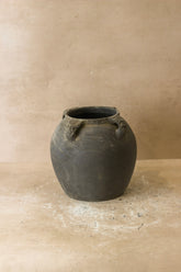 Dark gray ceramic vintage lion ears pot with four small rounded handles near the rim perfect for decor