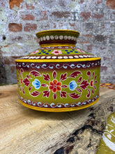 Vibrant lime green ceramic water pot with intricate red blue and orange floral patterns and yellow trim vintage style