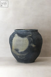 Dark blue ceramic vintage textured grey jar with hand carved surface and light beige patch vintage textured grey pot