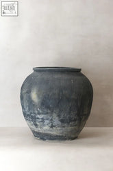 A vintage textured grey matte black ceramic jar with subtle ridges and an aged patina finish vintage textured grey pot vt07