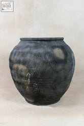 Vintage textured grey ceramic jar with rounded body and subtle horizontal ridges perfect for home decor
