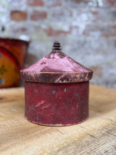 Vintage red metal tikka box with conical lid and dark knob ideal for trinket or jewelry storage