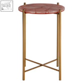 A round vita pink quartz side table with a pink marble top and gold metal crossed base legs