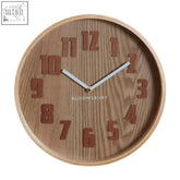 A vitus brown grain small wall clock with a round wooden face, raised brown grain numerals, and silver hands