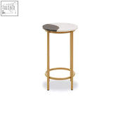 Vizzini side table with gold finish metal slim legs and a round vizzini marble top in white and dark gray with compact corners