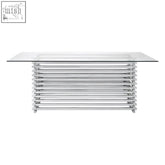 Modern chrome-finished vogue dining table with clear glass top and stacked horizontal metal legs dining table