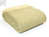 A beige waffle knit pure new wool throw with cream fringe perfect for cozying up check blanket size guide for fit