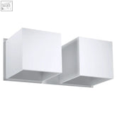 White minimalist two-light aluminum wall lamp with geometric cube design and modern g9 light bulb sockets