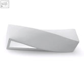White minimalist modern bench with clean geometric lines and matte finish paired with paintable ceramic wall lamp with light bulb
