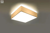 Square ceiling light with gold frame and bright white panel featuring an energy-saving light bulb for loft spaces