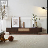 Dark wood ash wood wallace rattan tv stand with vertical slats and a central woven cane panel media console