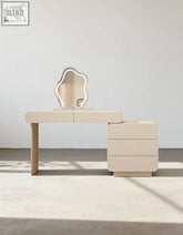 Cream dressing table with side cabinet and LED mirror featuring a beige minimalist vanity and sculptural irregular mirror